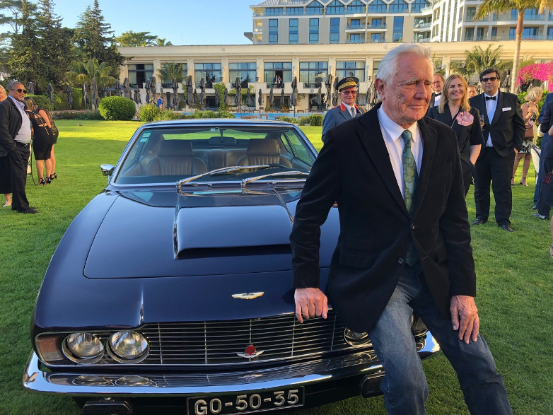 George meets the press with an Aston Martin