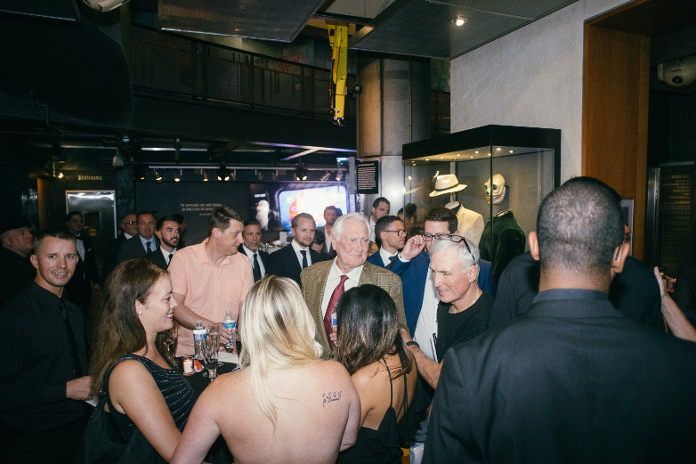 George Lazenby mingling with guests at The International Spy Museum